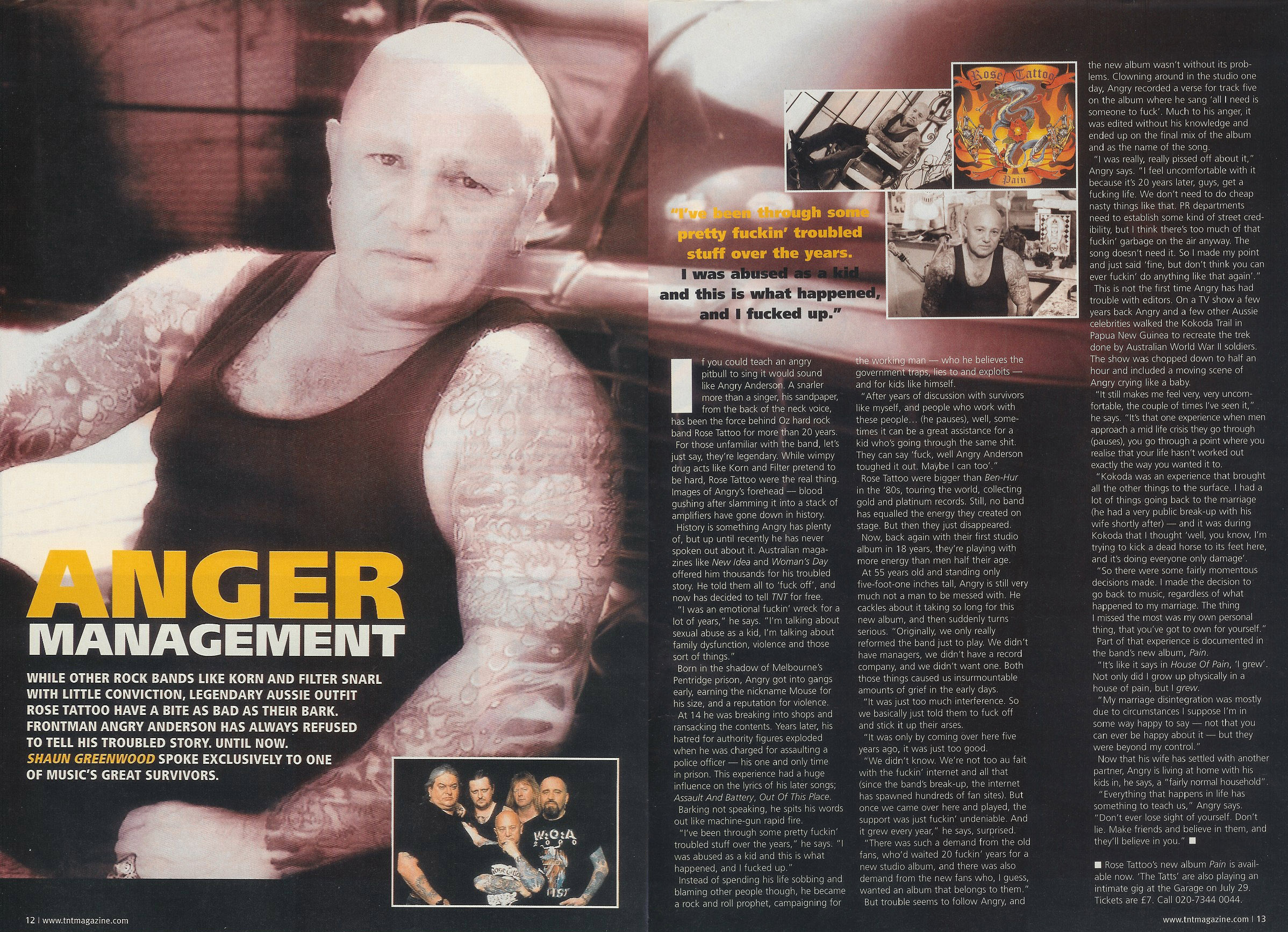 Close-up of Rose Tattoo frontman Angry Anderson in a black tank top, showing his tattooed arms and head.