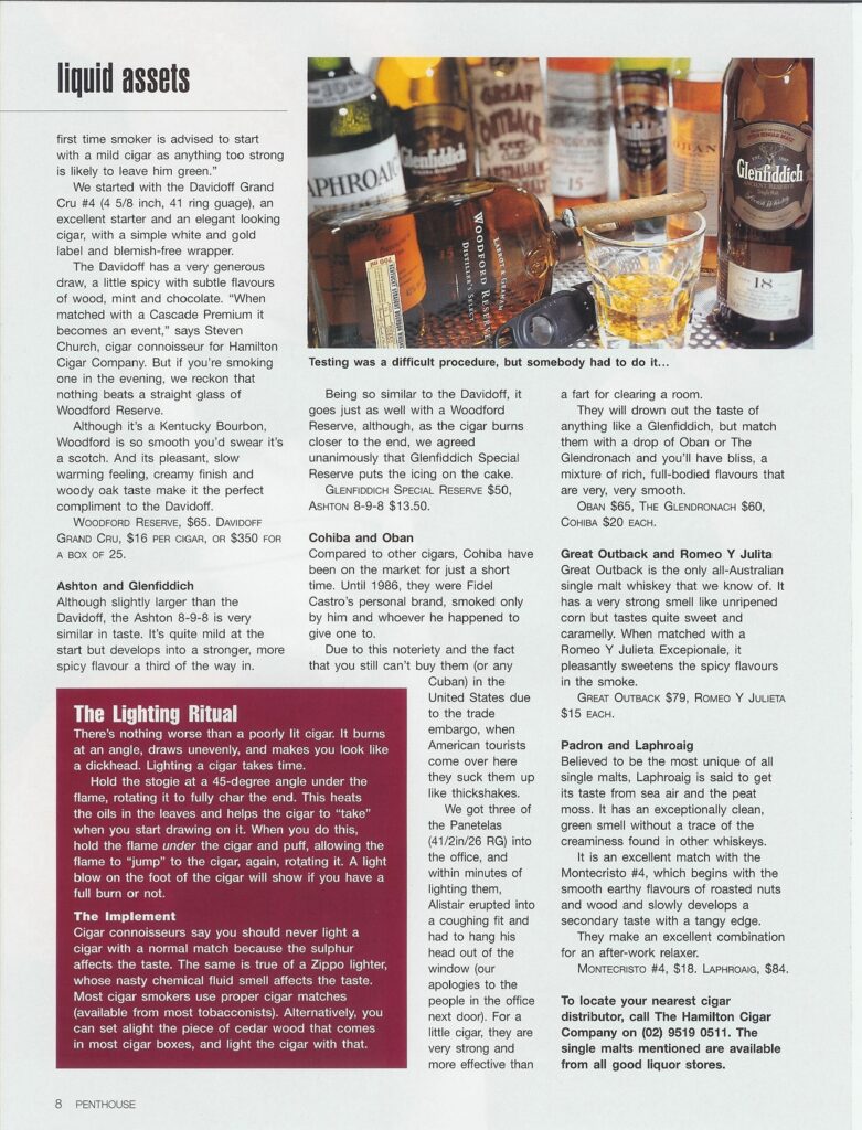 A flat lay of various premium whiskey bottles and cigars, including Glenfiddich and Woodford Reserve, on a table