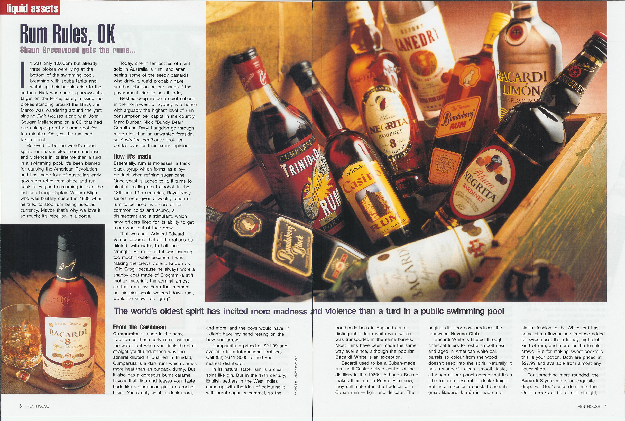 Various rum bottles like Trinidad and Casino Rum arranged inside a wooden crate with warm lighting.