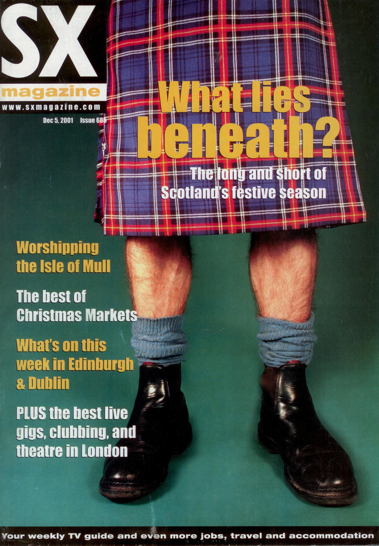 Close-up of a person's legs wearing a blue and red plaid kilt, blue socks, and black boots on SX Magazine cover.